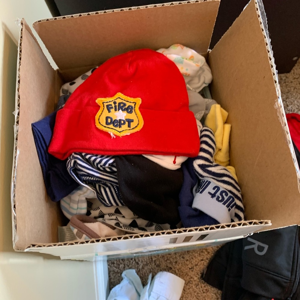 Box of new born baby boy hats , bibs, swaddles